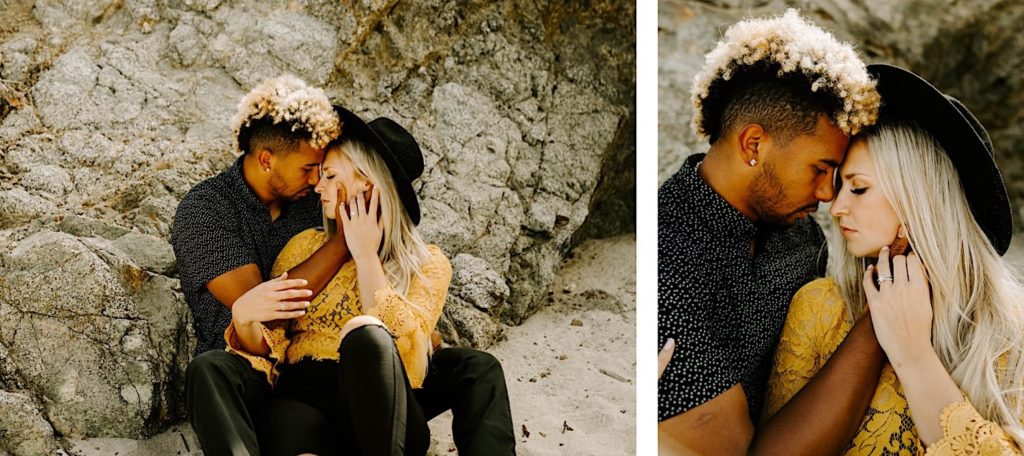 couple cuddling at garapata state beach california