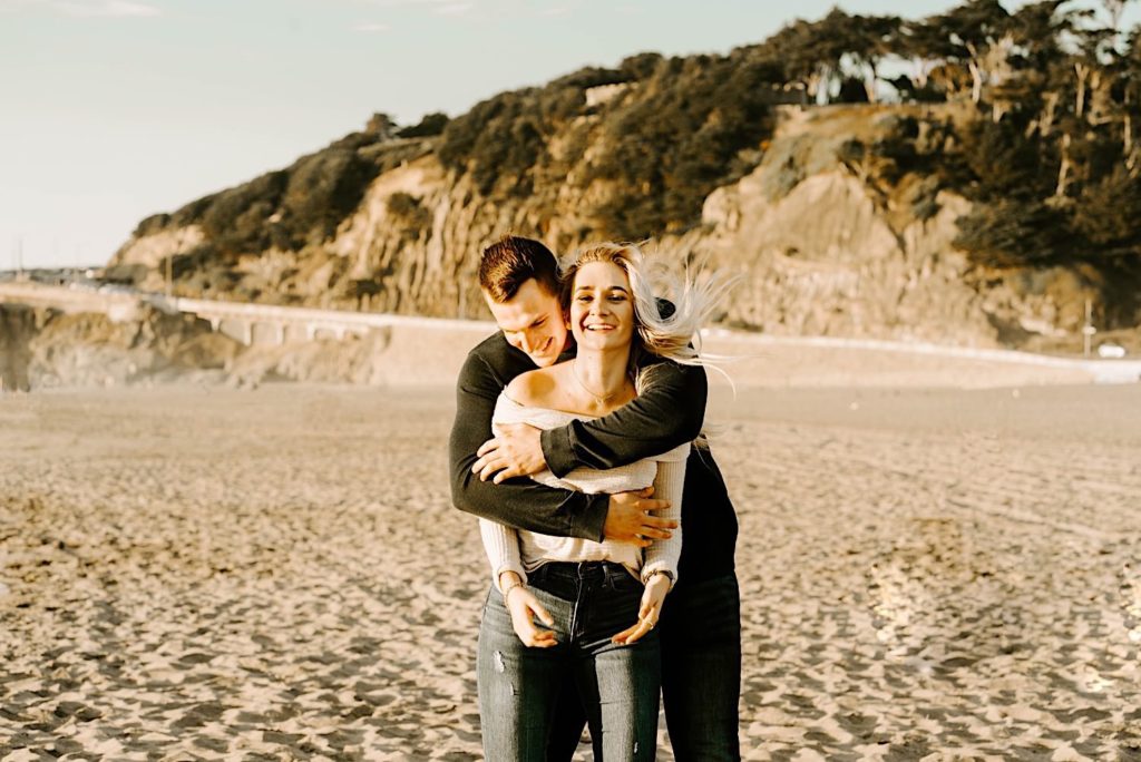 couple embracing ocean beach san francisco