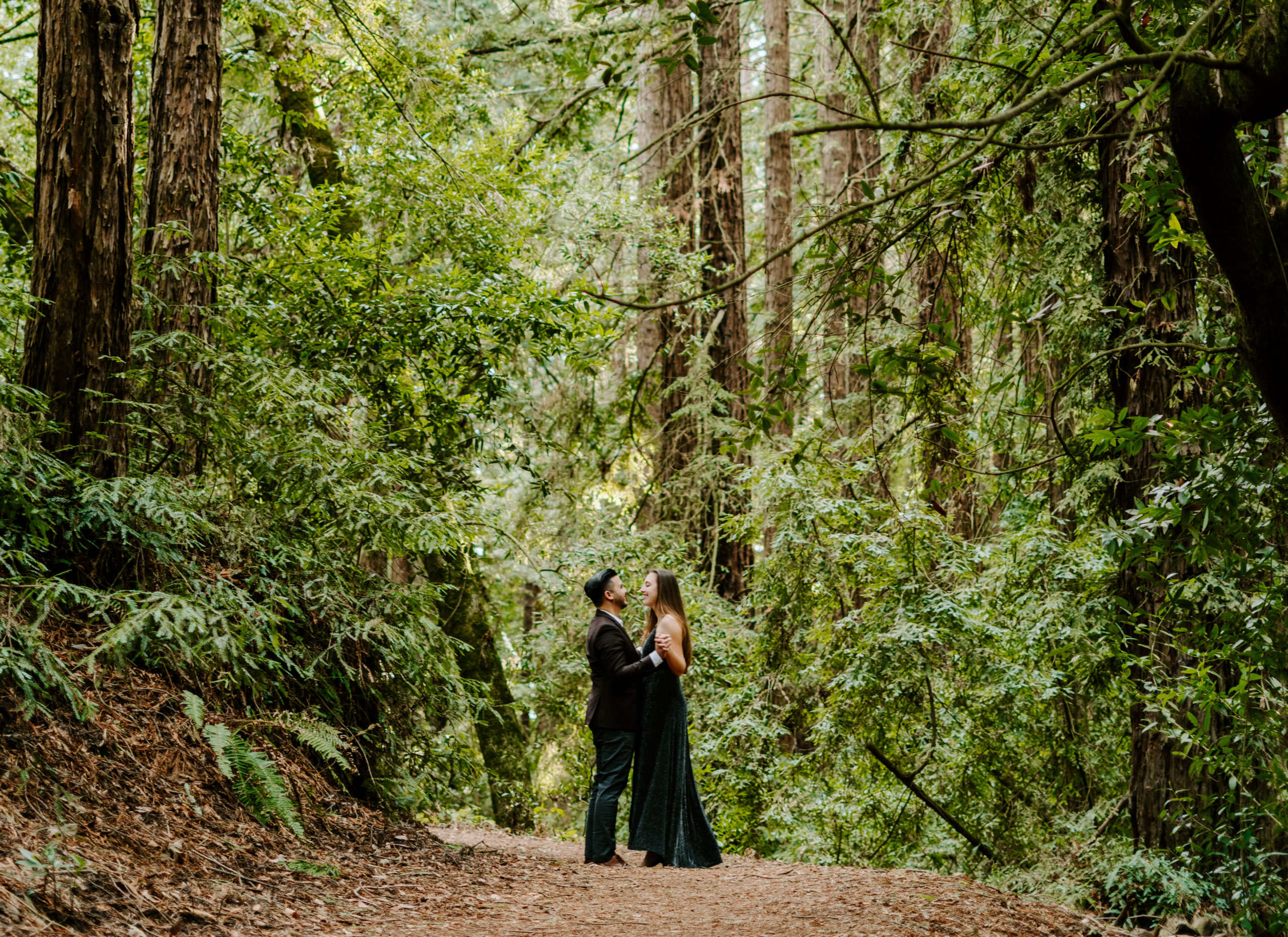 Couple dancing in the redwoods. Shot by Bay Area photographer Torez Marguerite