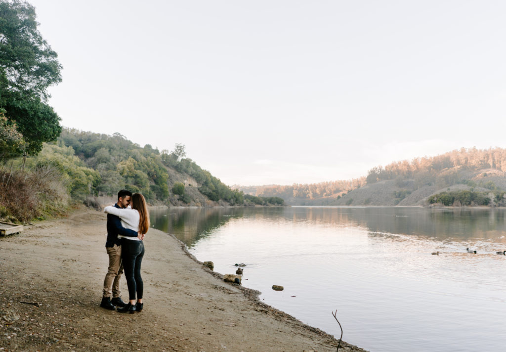 Couple dancing by the lake in Oakland, California.