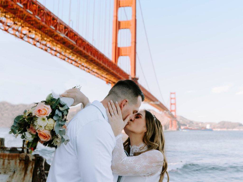couple eloping under the Golden Gate Bridge in California