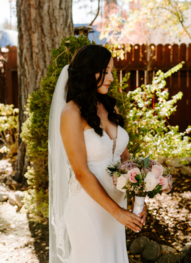 Portrait of the bride with her bouquet.