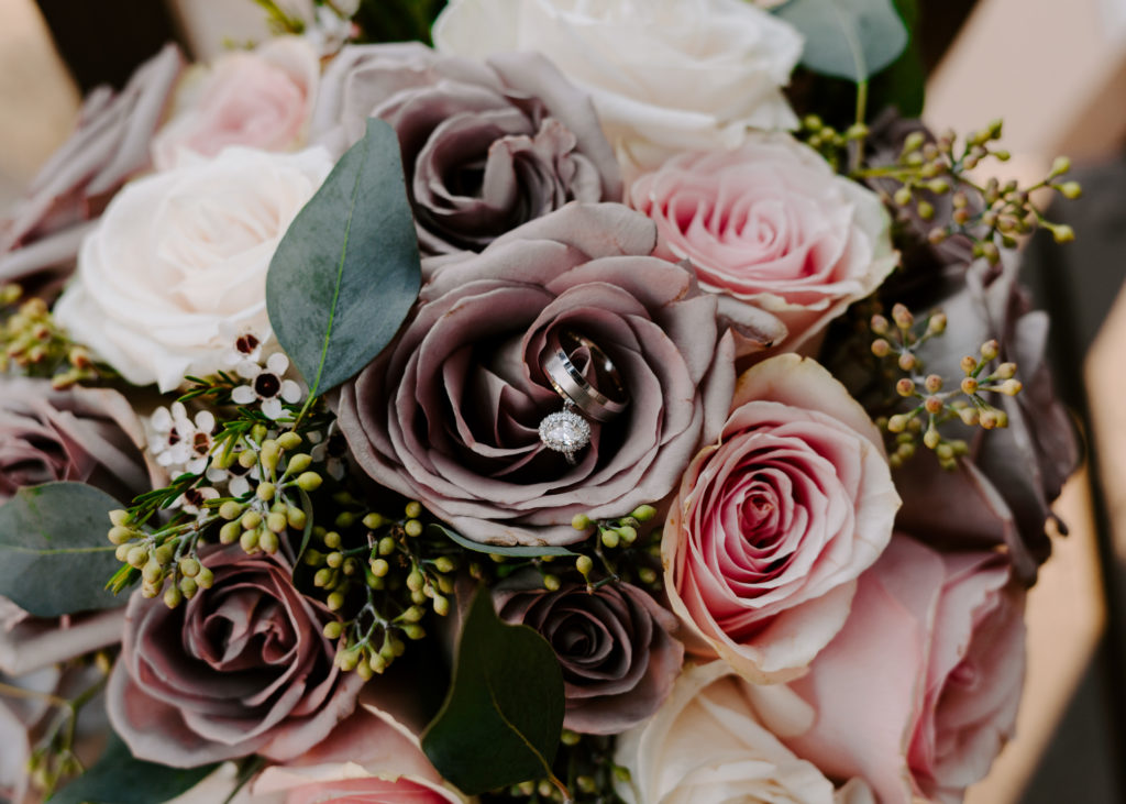 Wedding rings inside of flower bouquet