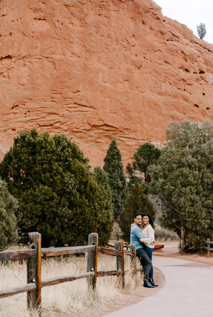 Couple smiling in Garden of the Gods.