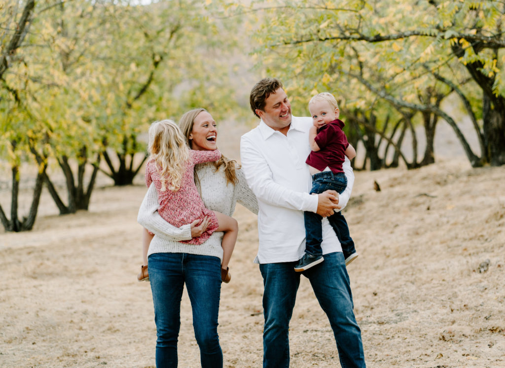 Family laughing at their youngest son.