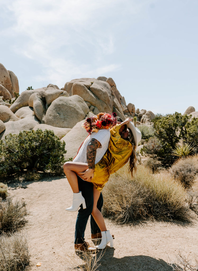 Man and woman almost kissing in Joshua Tree.