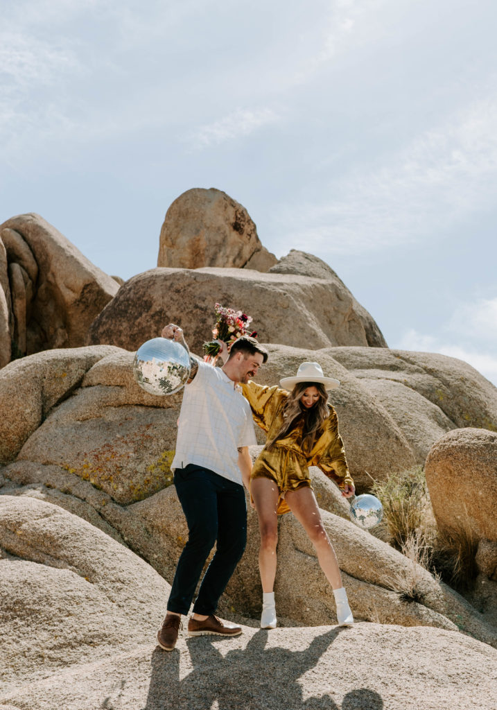 Couple dancing with each other in Joshua Tree National Park.