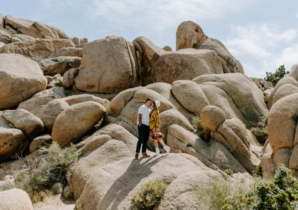Woman and man kissing on Jumbo Rocks.