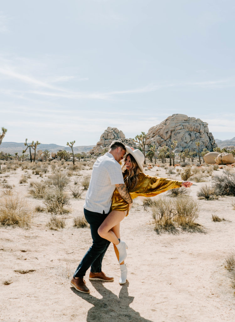 Woman and man dancing together in Joshua Tree.