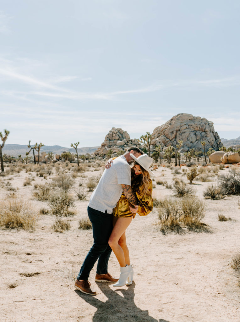 Woman and man hugging each other in Joshua Tree.
