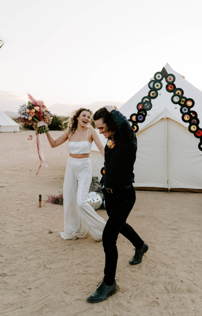 Bride and groom laughing at their wedding.