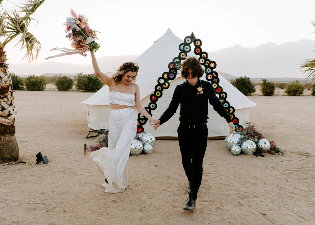 Bride and groom celebrating after getting married in Palm Springs.
