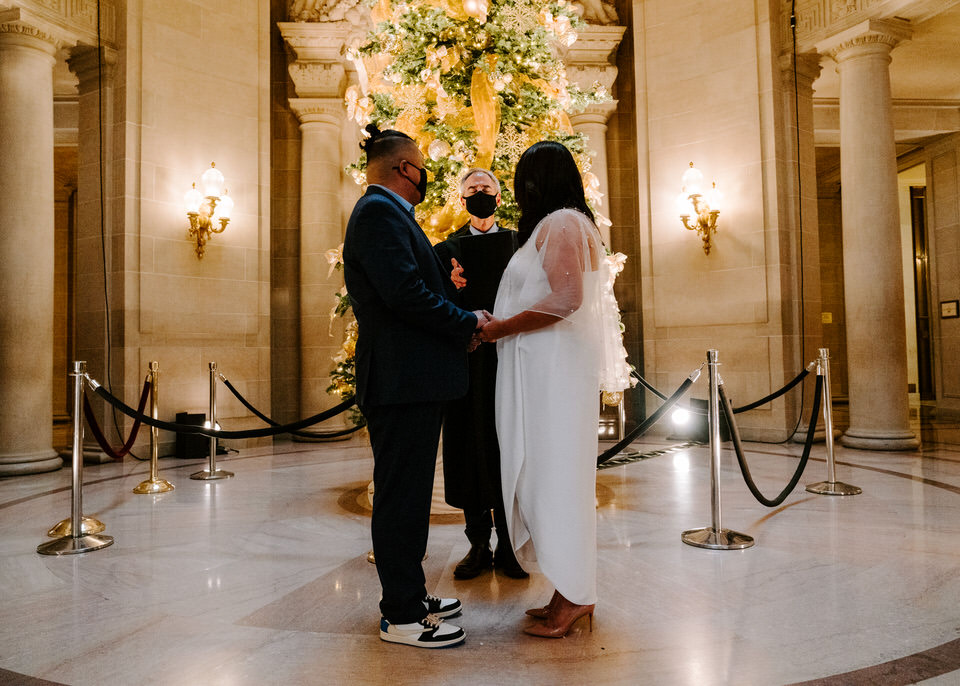 bride and groom getting married at San Francisco City Hall