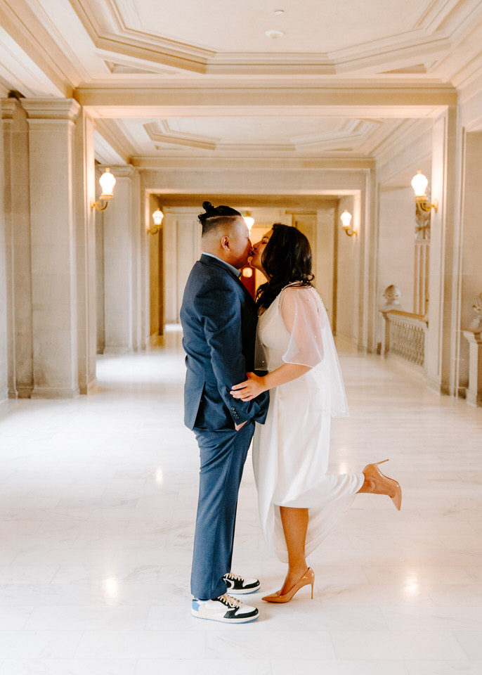 bride and groom posing for San Francisco City Hall Photographer