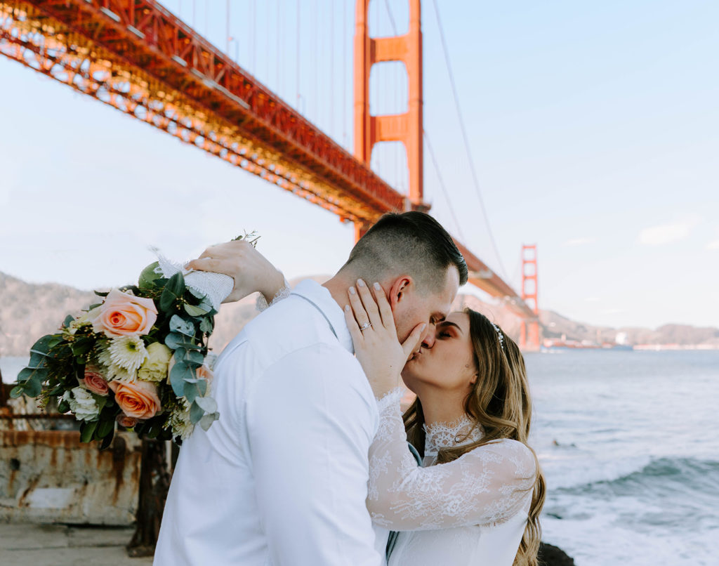Bridge and Groom kissing at Golden Gate Bridge