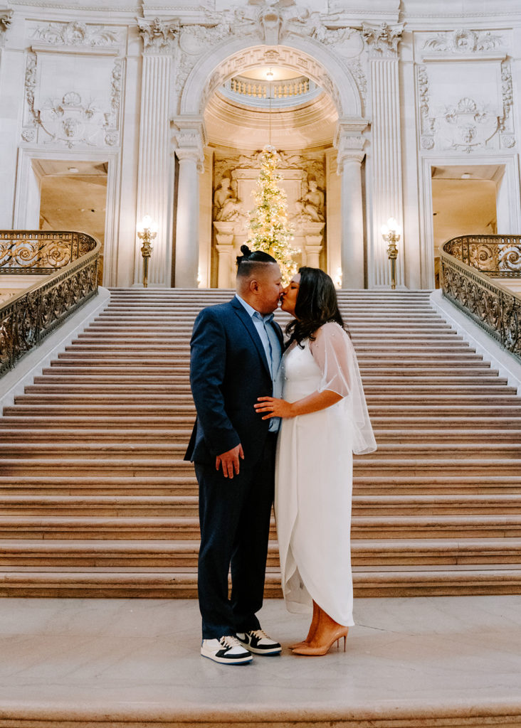Couple at the grand staircase in San Francisco City Hall.