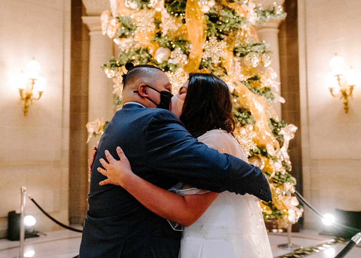 Couple kissing after getting married at San Francisco City Hall