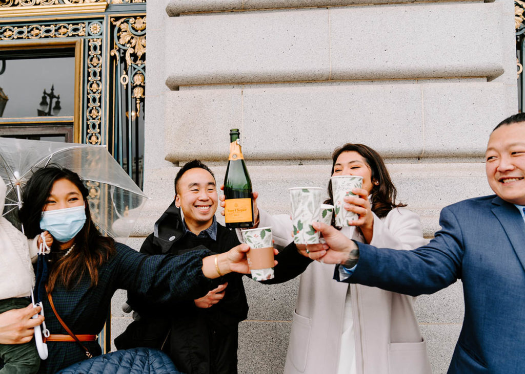 Everyone raising a toast to the newly weds.