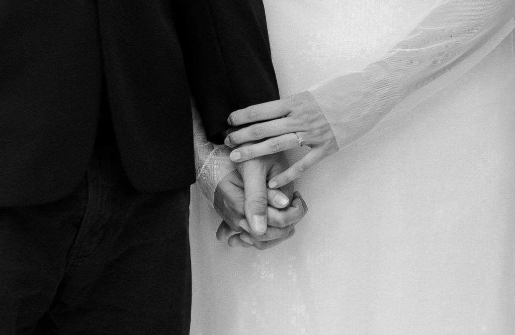 Hands of bride and groom.