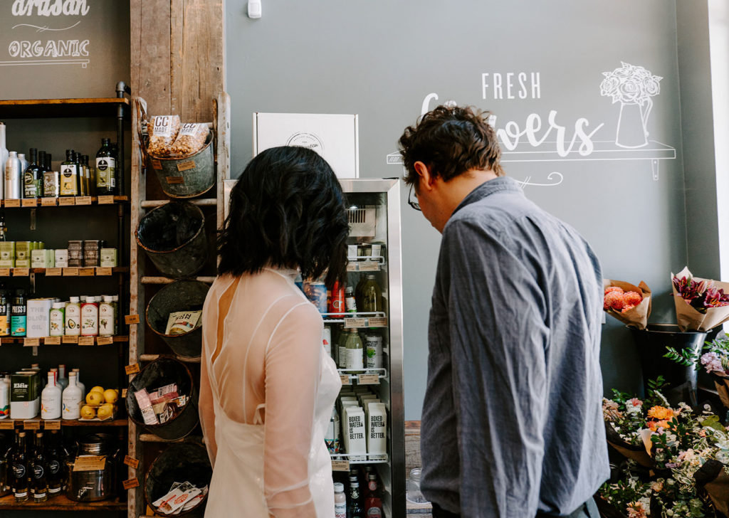 Couple deciding what they want at a store.