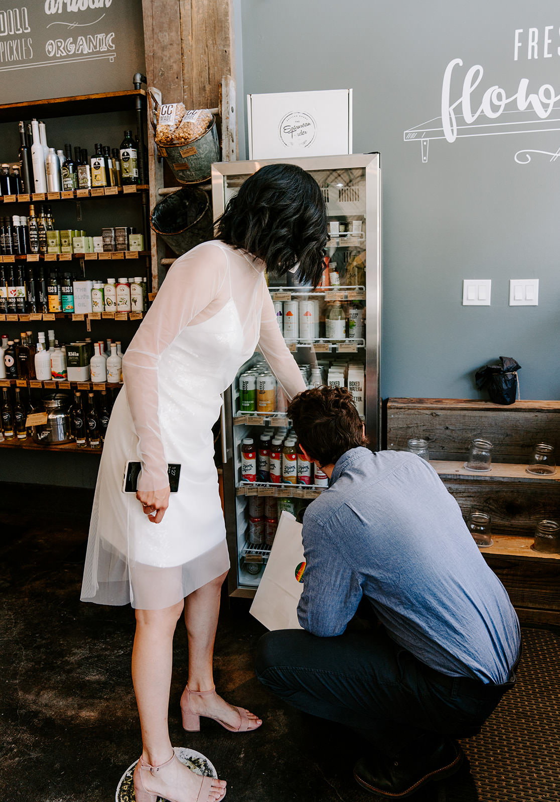 Couple picking out what they want to drink.