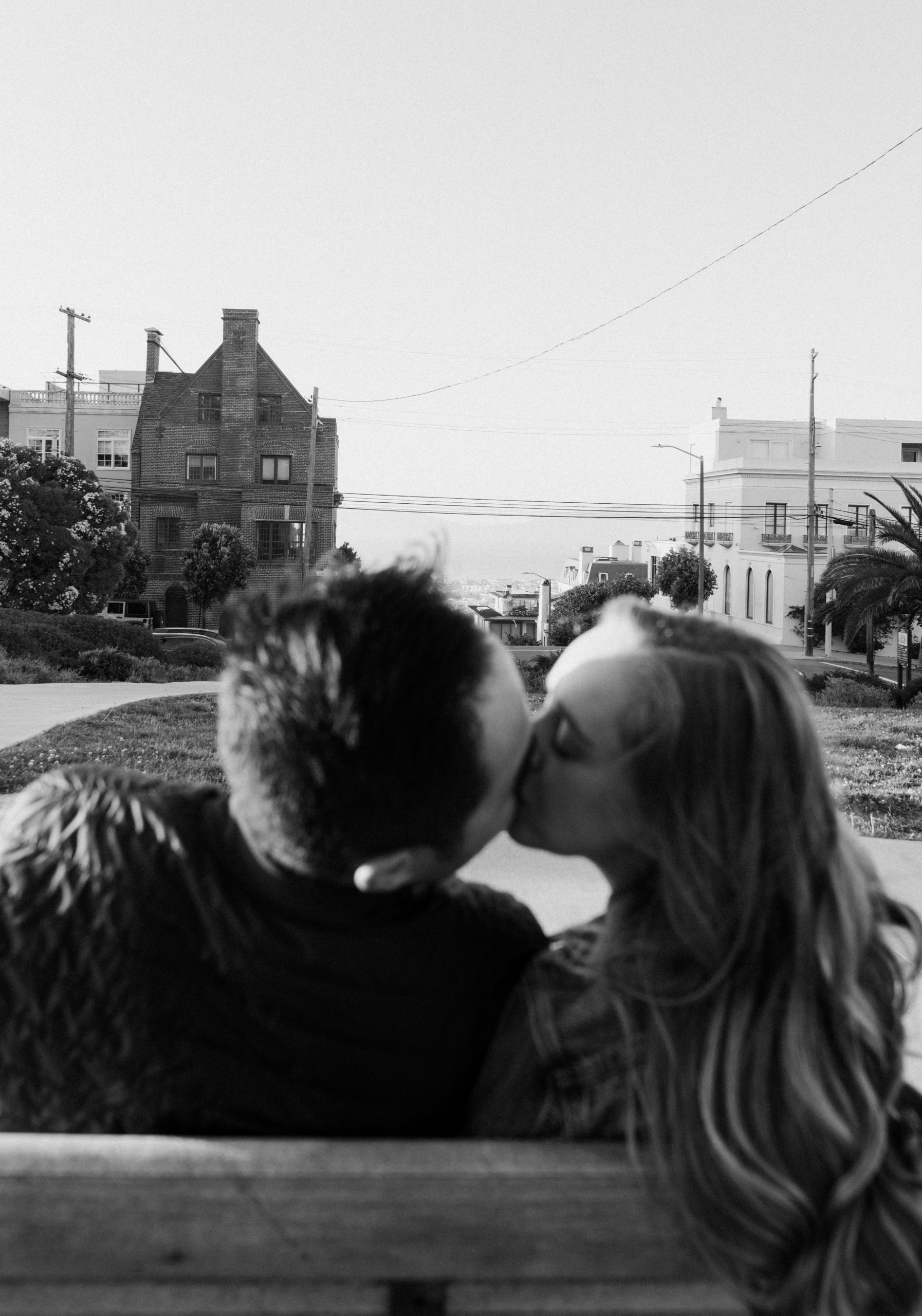 Couple kissing in Alta Plaza Park.