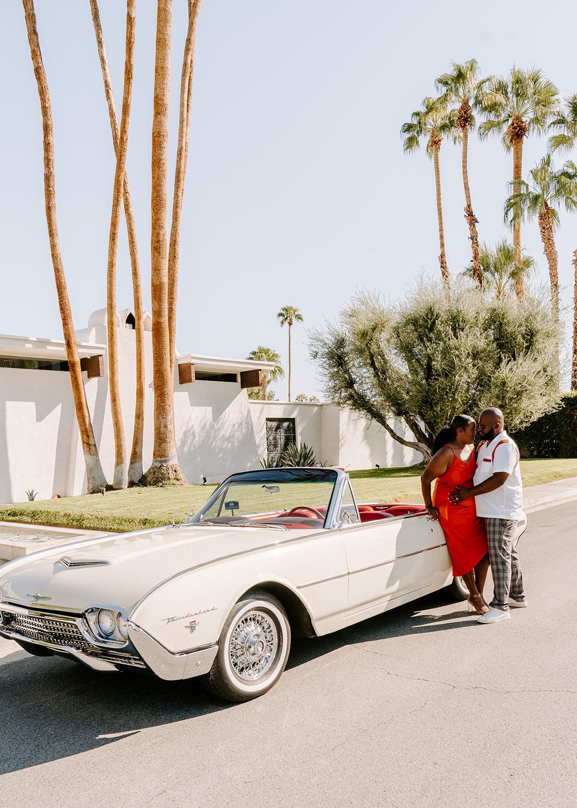 couple in front of classic car