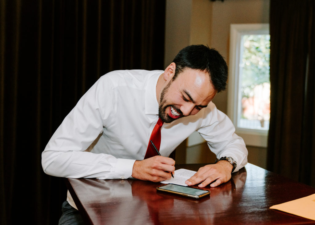 groom writing vows