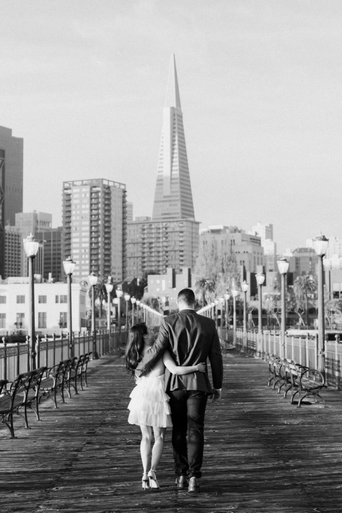 couple walking towards downtown San Francisco.