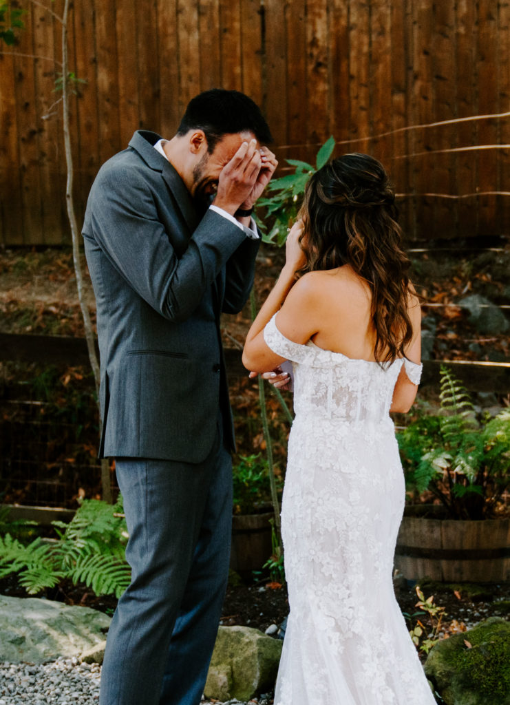 bride and groom crying during first look