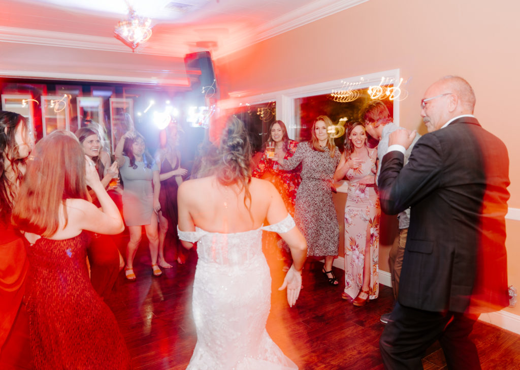 bride and father of groom dancing