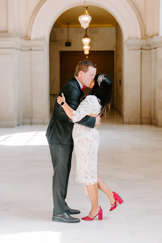 bride and groom kissing 4th sf city hall