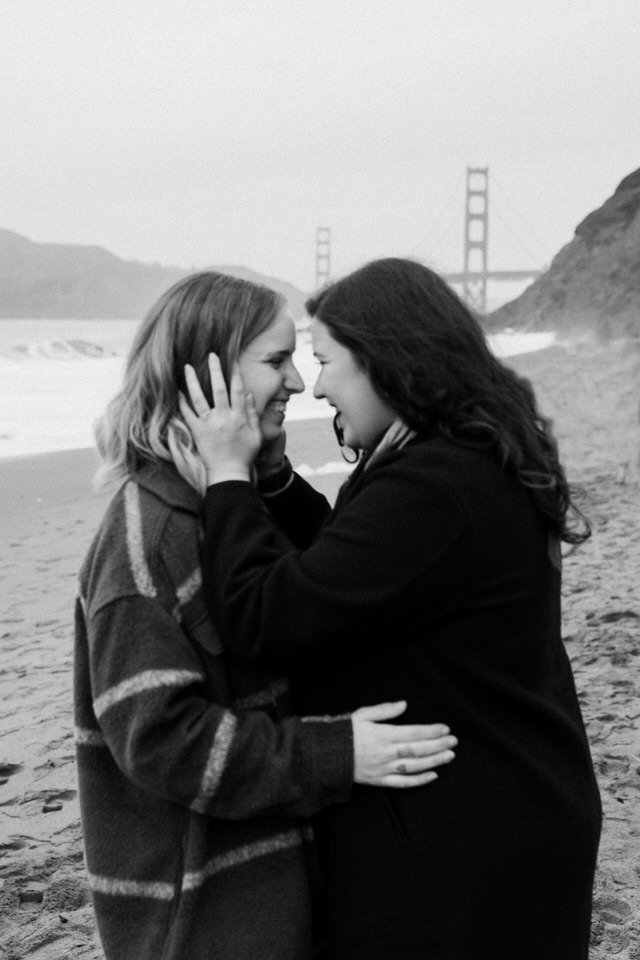 couple laughing on the beach