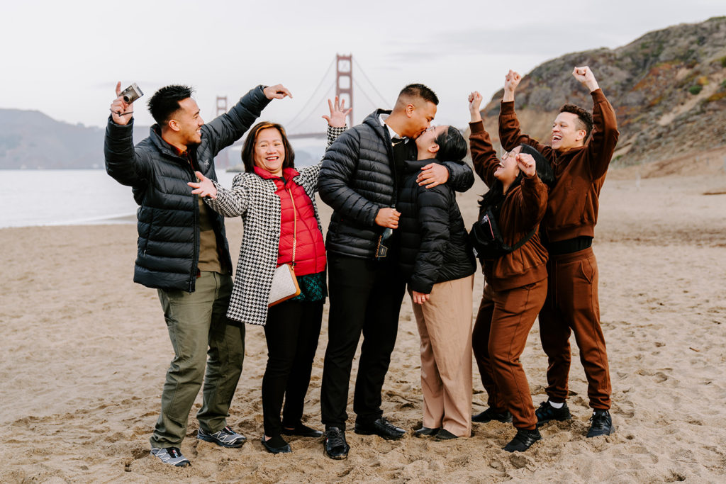 family celebrating baker beach