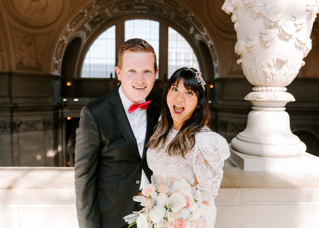 bride and groom in sf city hall