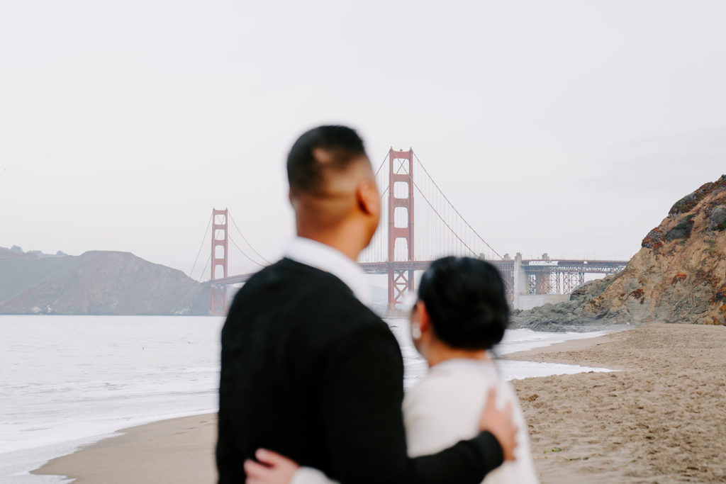 couple looking at the golden gate bridge