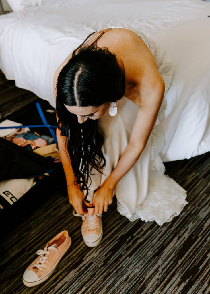 bride tying shoe