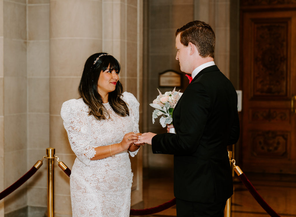 couple exchanging ring during civil ceremony