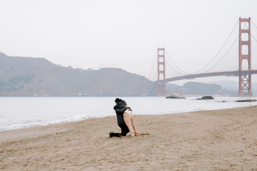couple hugging at baker beach