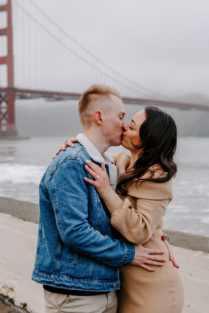couple kissing after fort point san francisco proposal