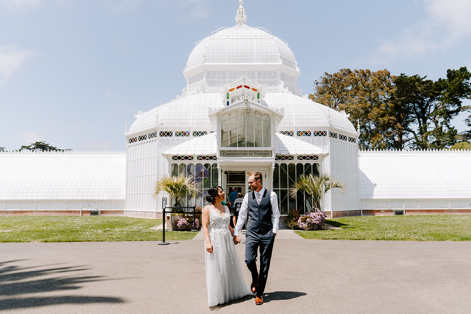 Couple walking from the Conservatory of Flowers during their City Elopement.