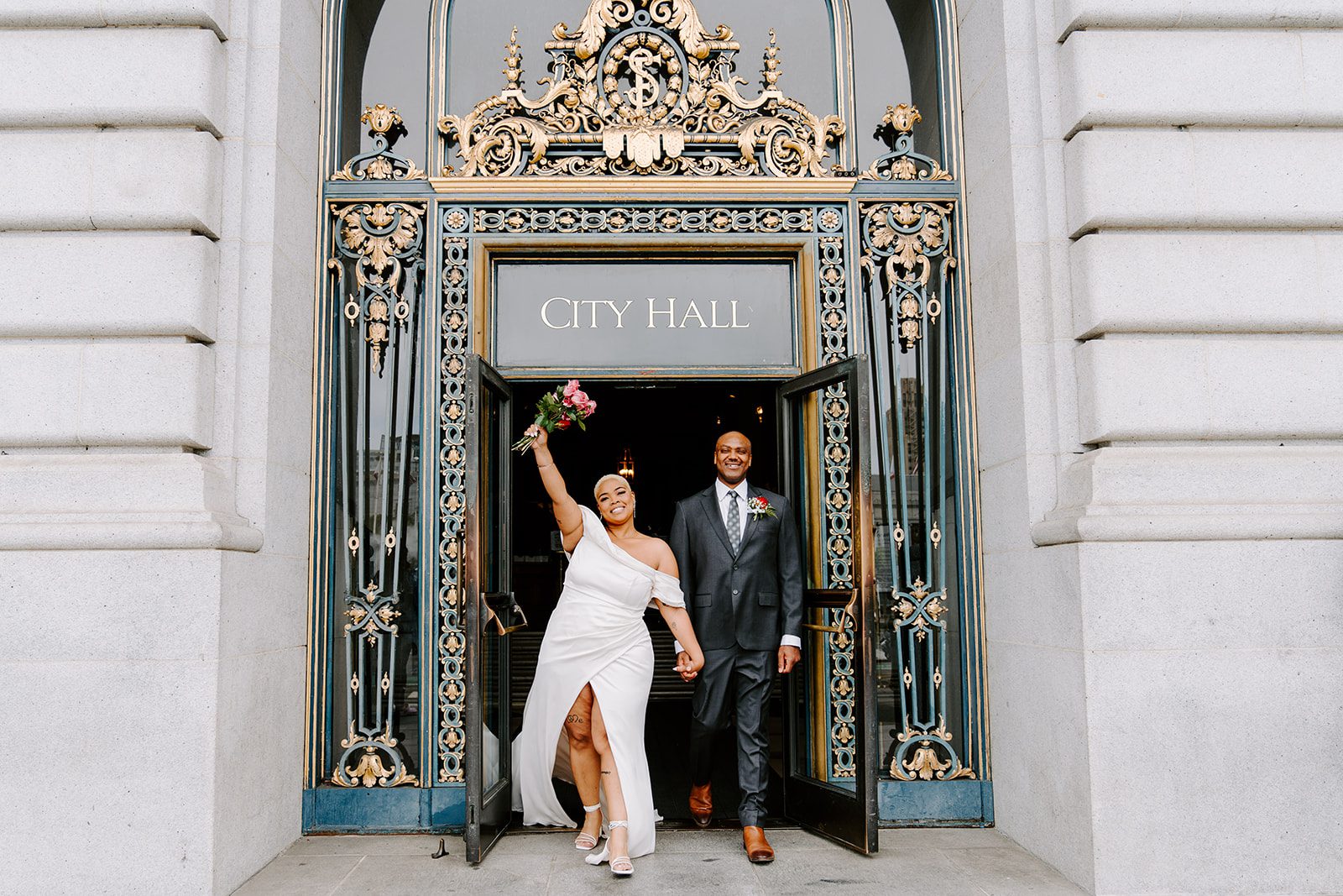 Bride and groom walking out after their SF City Hall Elopement.