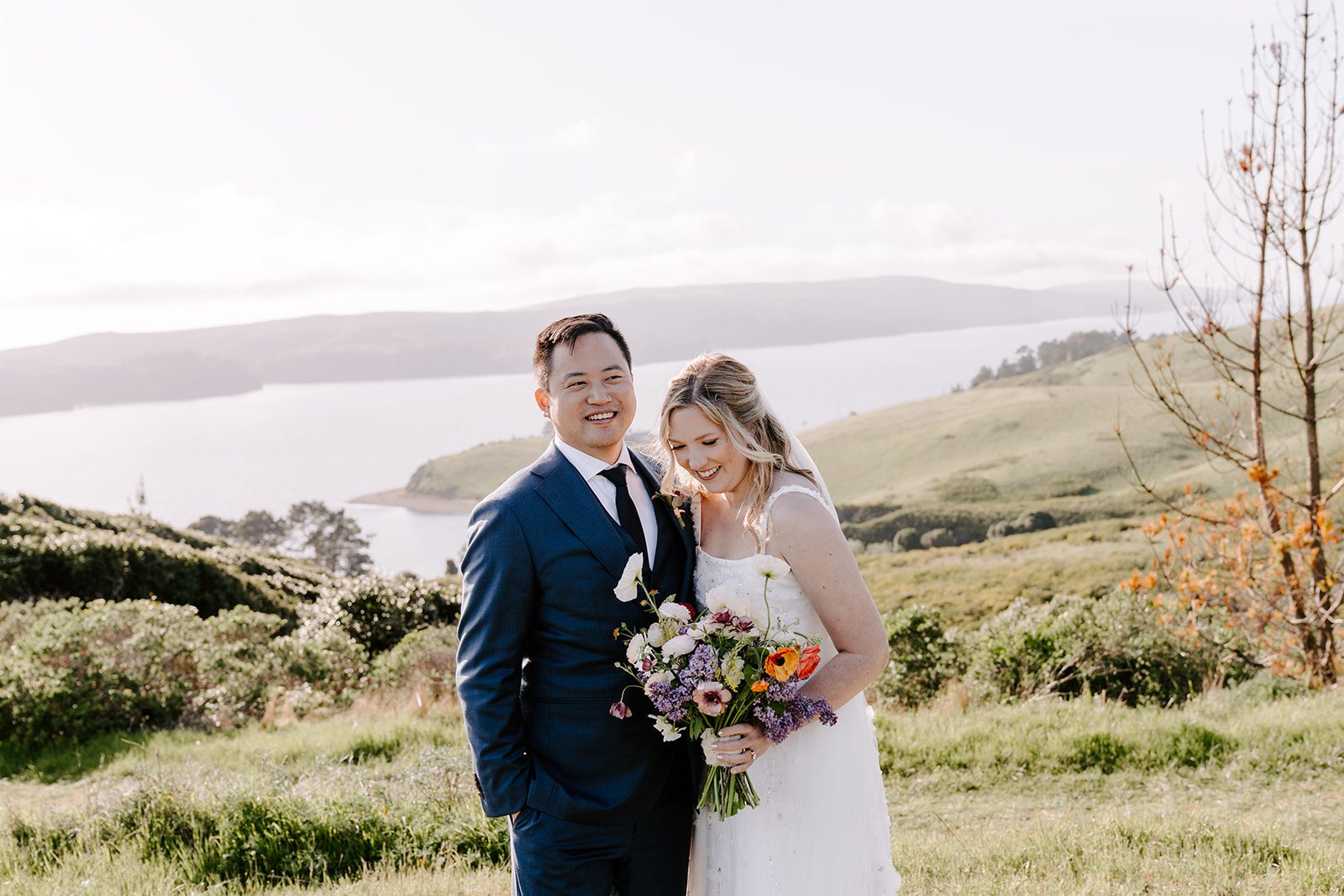 bride and groom laughing after ceremony